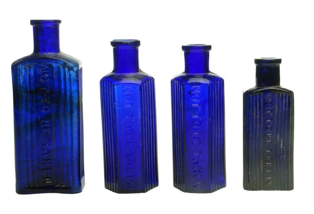 Four Cobalt Blue Poison Bottles