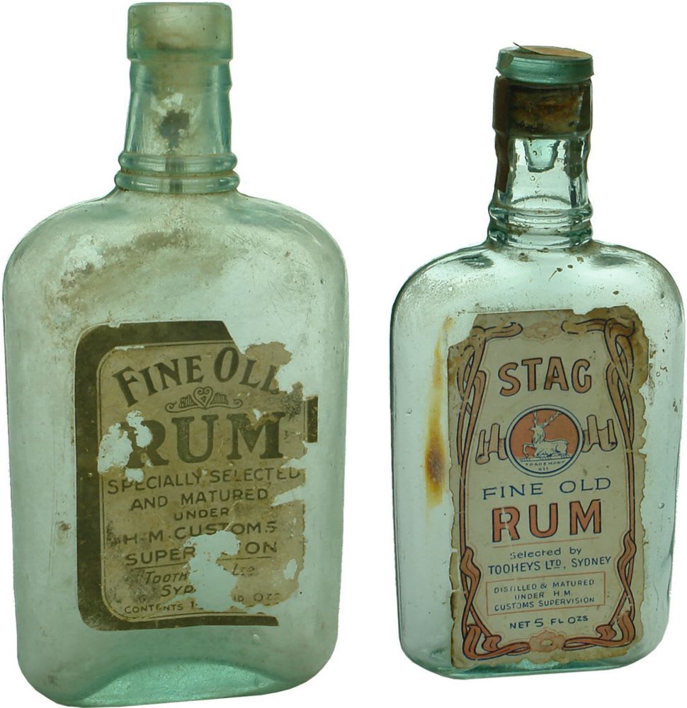 Pair of labelled rum bottles. Tooths and Tooheys.