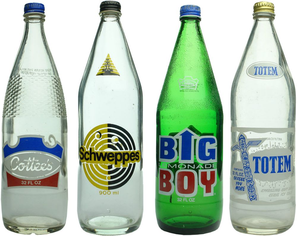 Four large Screw Top Ceramic Label Soft Drinks.