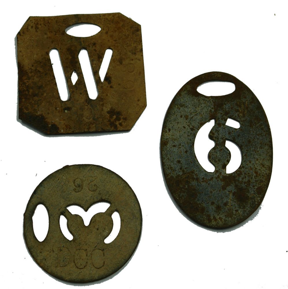 Three metal stencils. Council markings?