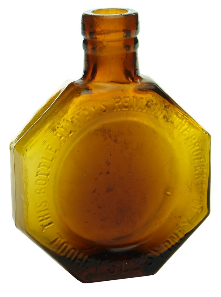 Brandy. Flask. Amber glass Toohey's Ltd Sydney.