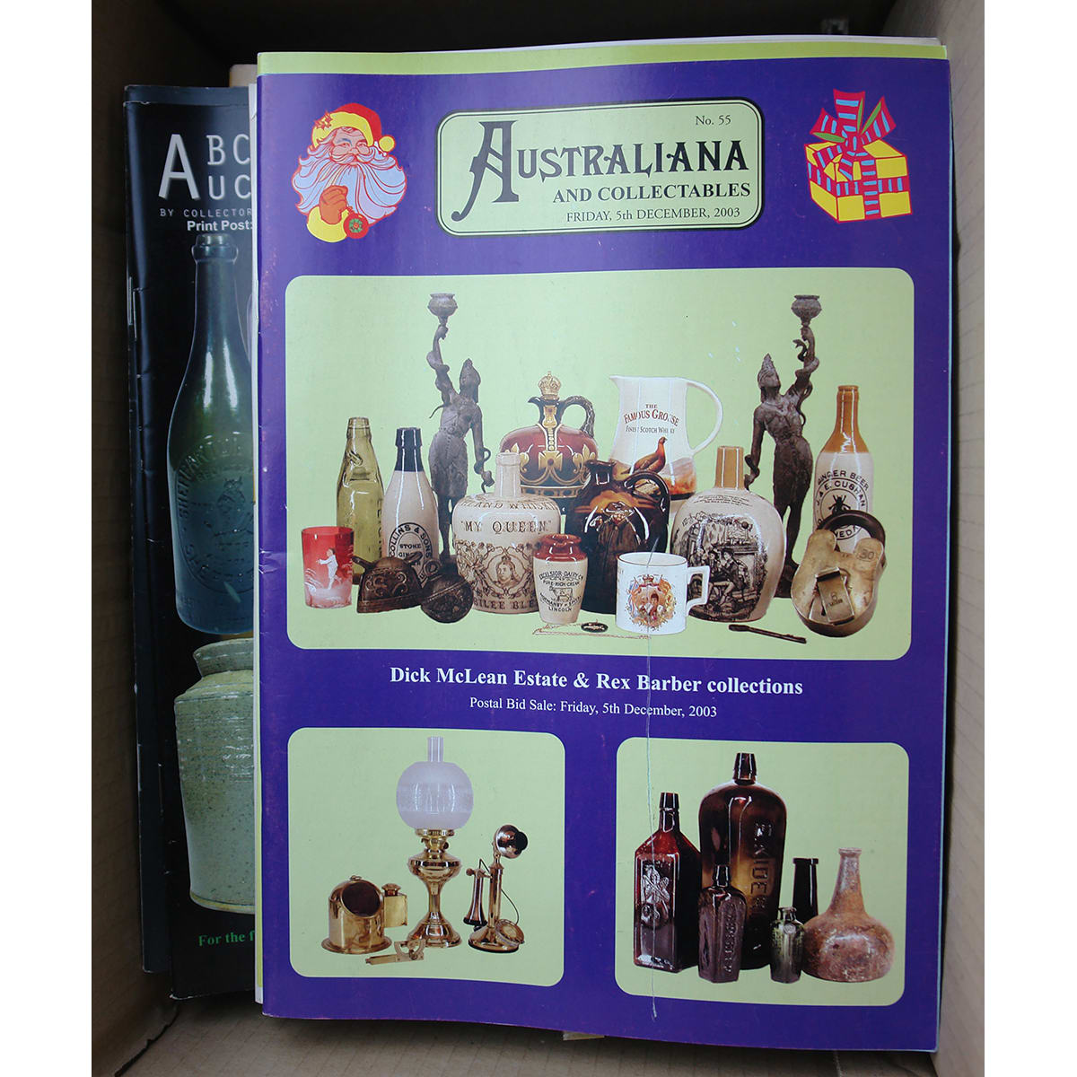 Box with large number of Australian bottle and colletables auction catalogues and price lists.