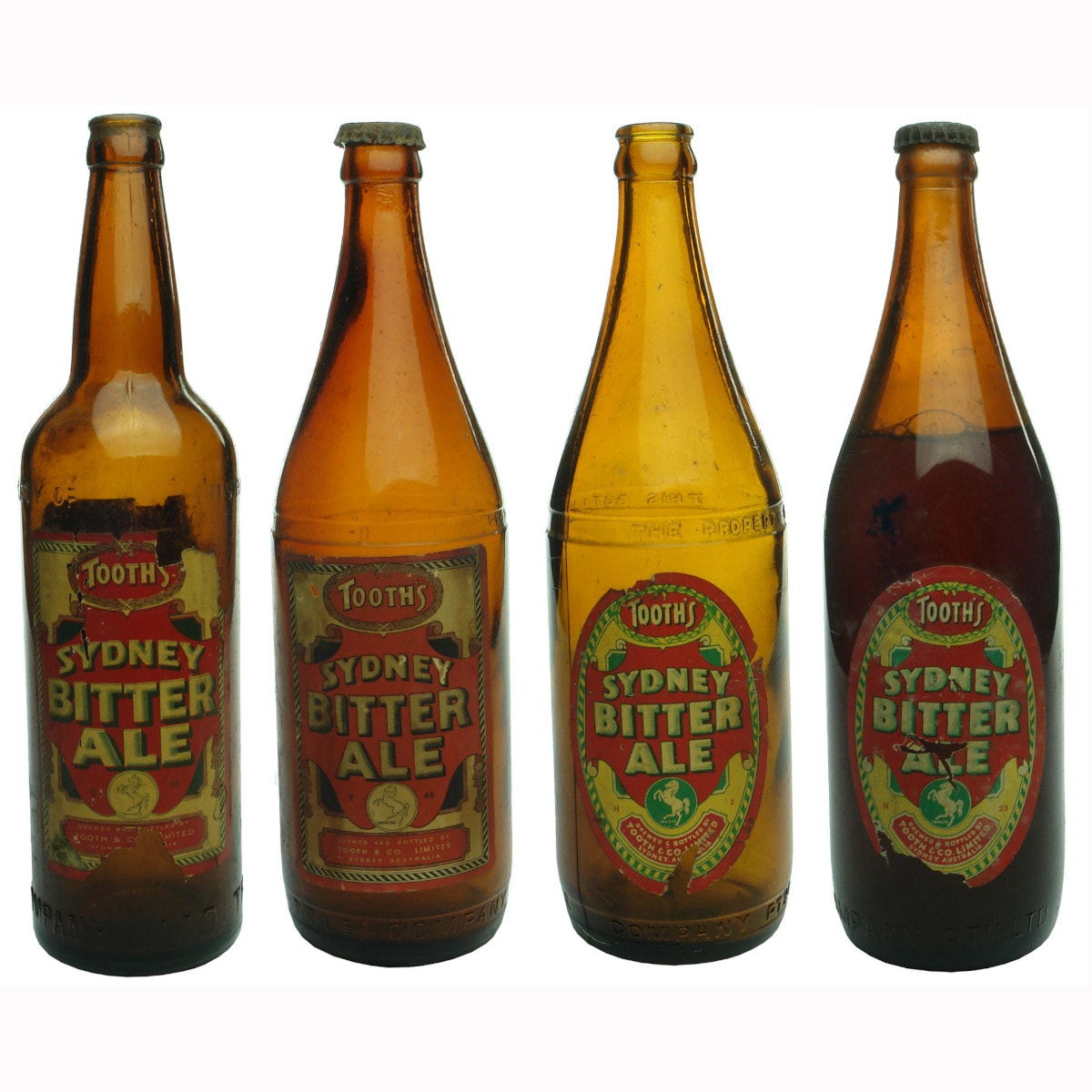 Four NSW Bottle Company bottles with original labels for Tooth' s Sydney Bitter Ale. Different eras of the same beer.