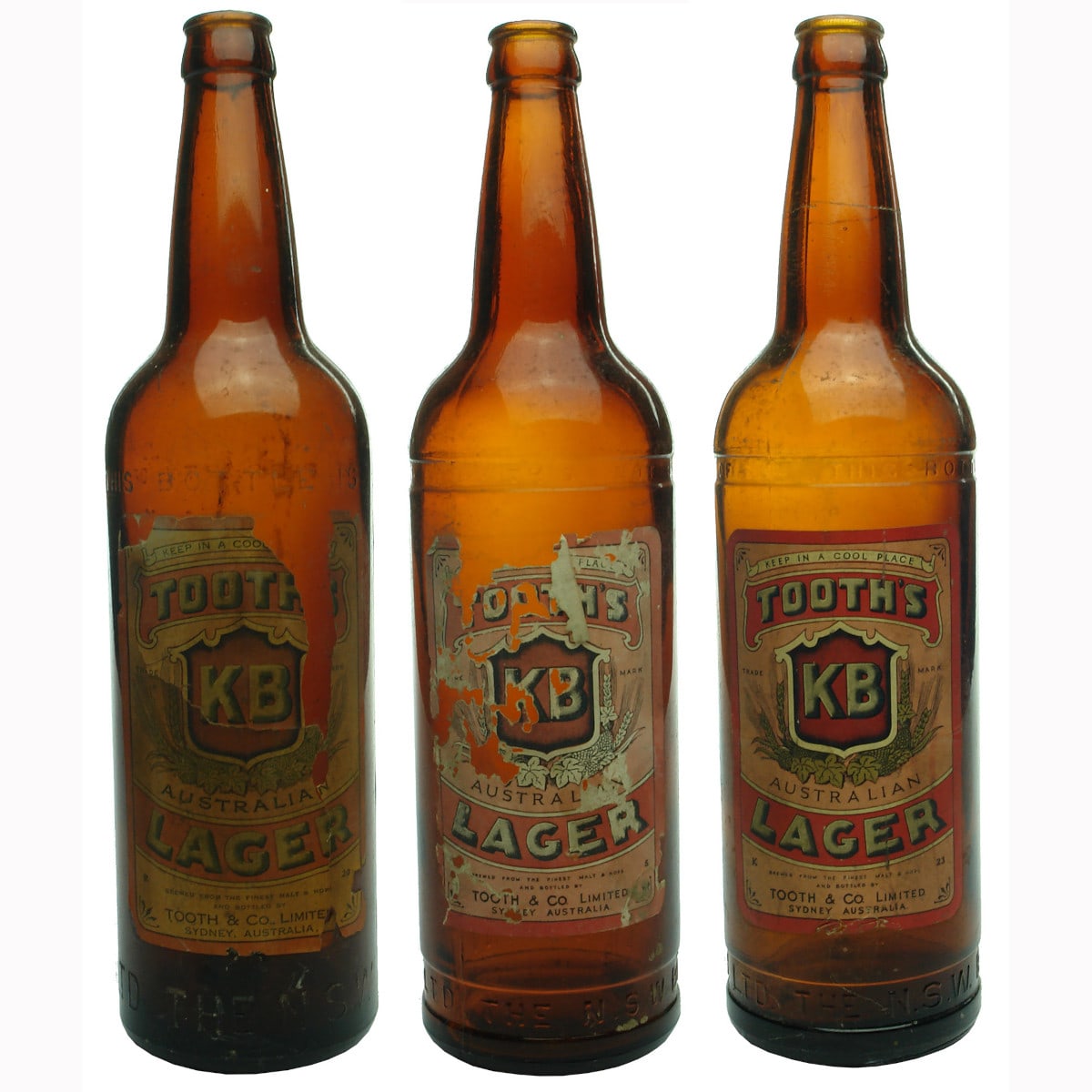 Three Labelled Tooth's KB Lager Beer Bottles.