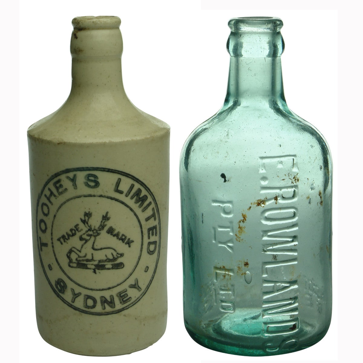 Pair of Bottles: Tooheys Crown Seal Ginger Beer and Rowlands Dumpy Crown Seal.