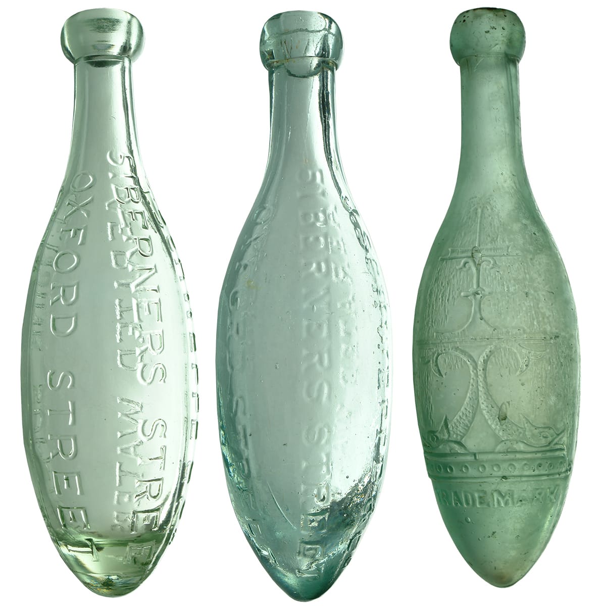 Three Schweppes Torpedo Bottles. Two old ones and a modern commemorative type.