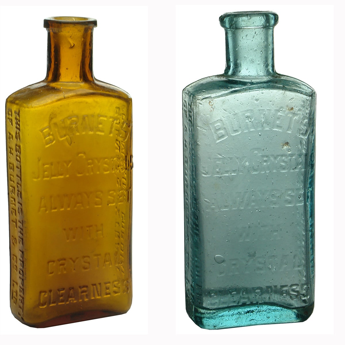 Two Burnet's Extract Bottles. One amber and one aqua.