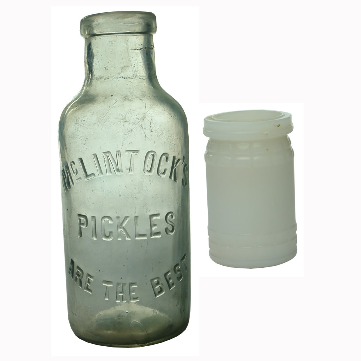 Two Household Jars: McLintock's Pickles and Milk Glass Pecks Paste.