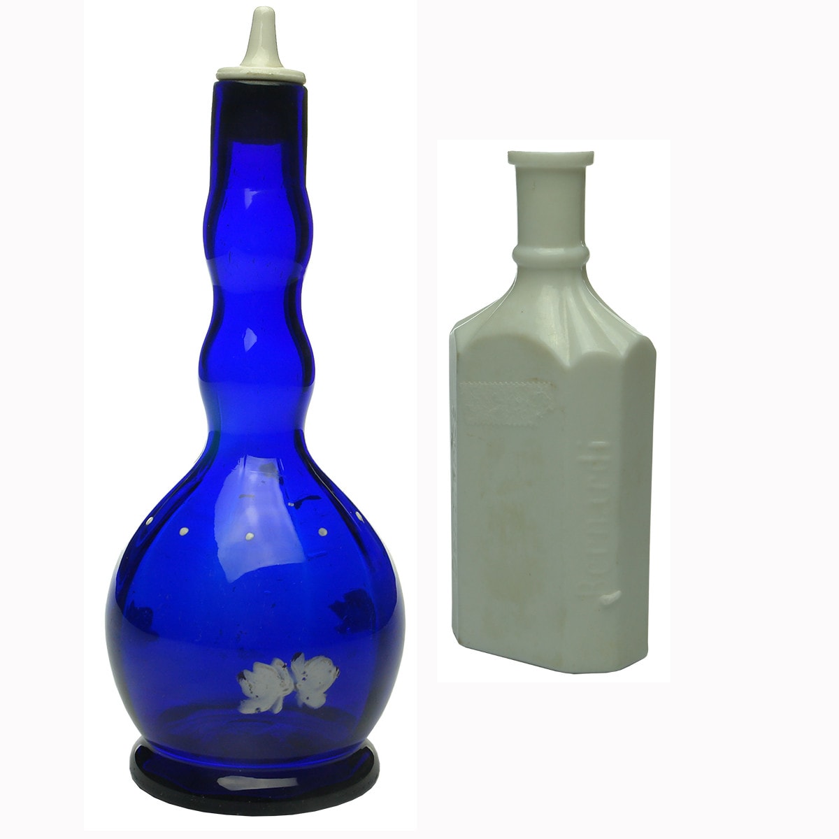 Pair of Medicine/Bathroom type bottles: Barbers bottle and Bernardi's Dentifrice.