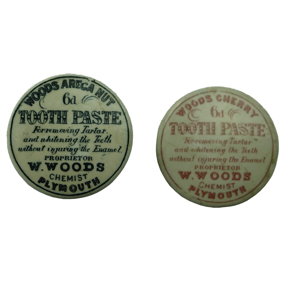 Two Wood's Tooth Paste Lids. Black Print and Red Print.