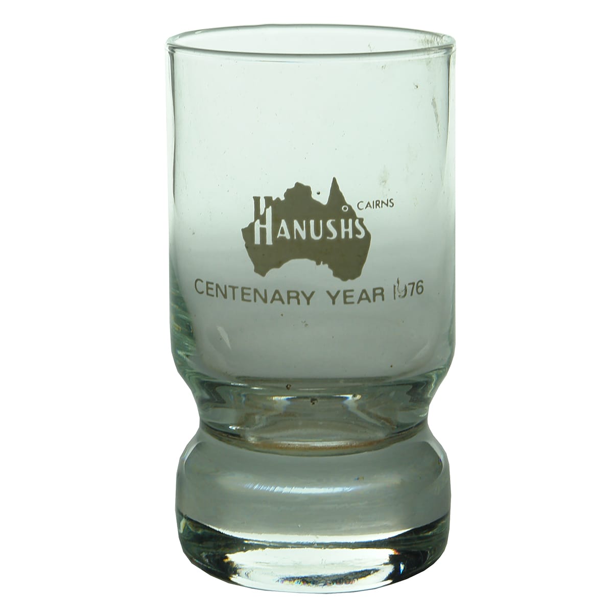 Drinking Glass. Ceramic Label. Hanush's Cairns Centenary 1976. (Queensland)