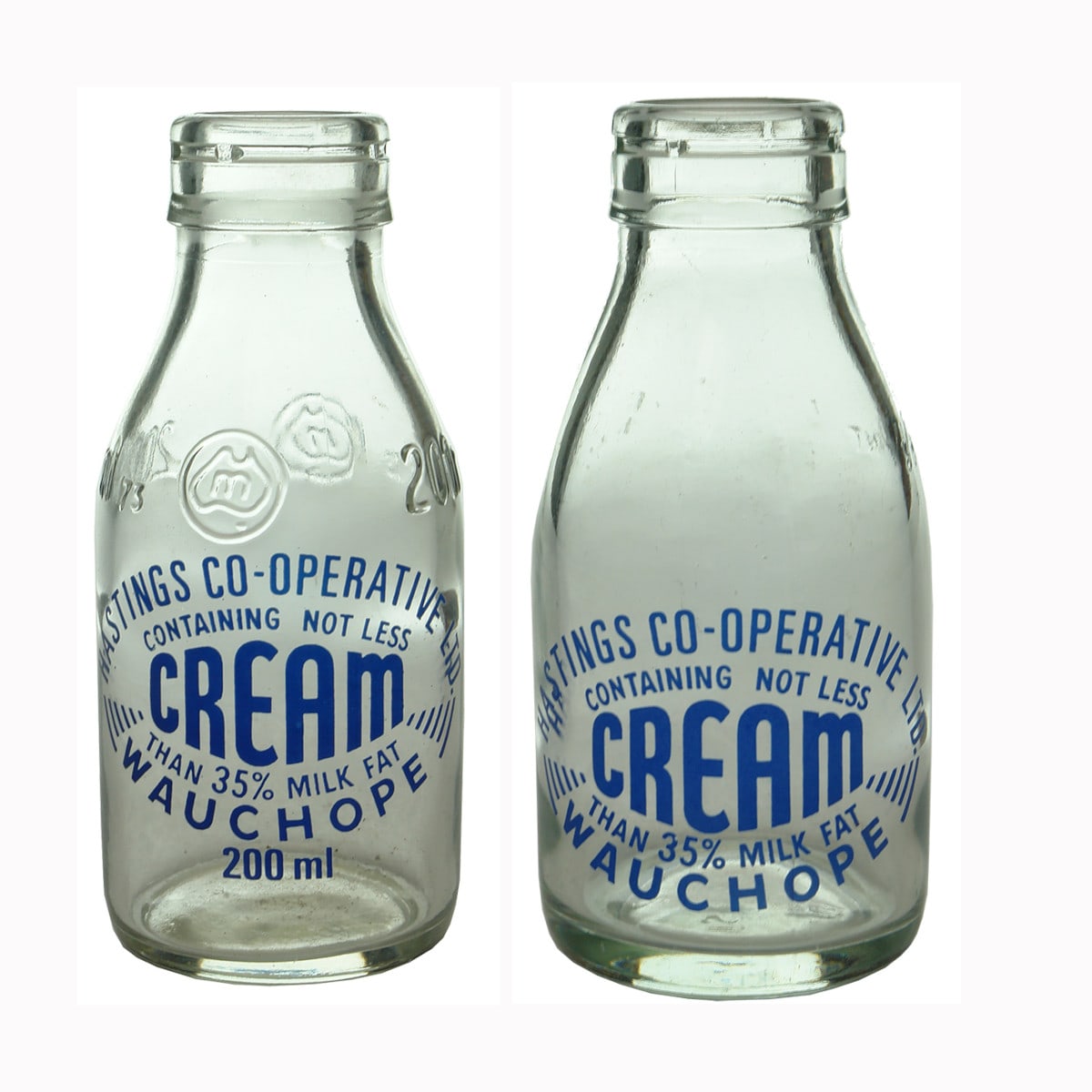 Pair of small Hastings Co-Operative Ltd., Wauchope Cream bottles. Foil top. Ceramic label. (New South Wales)