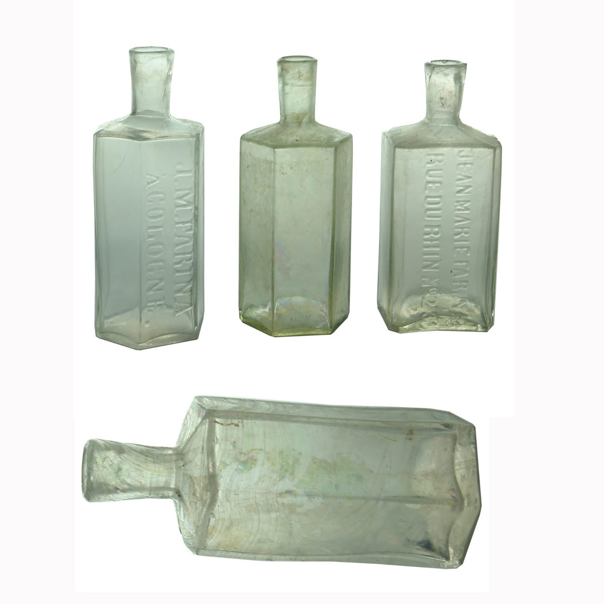 Four pontil scarred Cologne Bottles. 2 Embossed Farina and 2 plain.