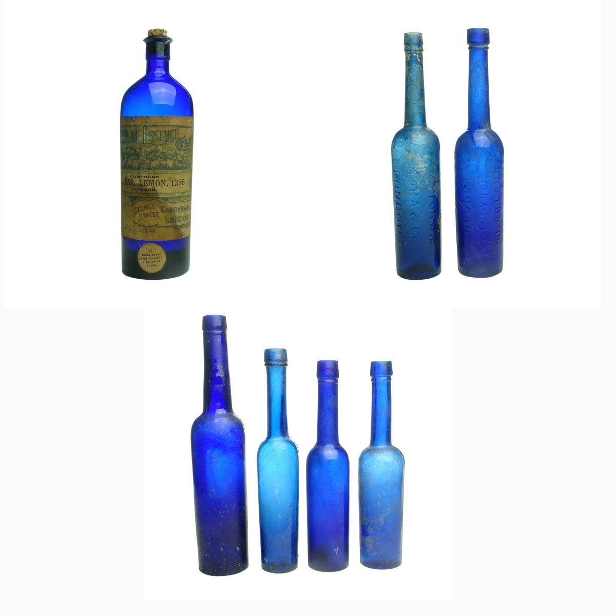 Seven Cobalt Blue Bottles: Labelled essence; 2 x Hora, London embossed castor oils and 4 plain castor oils.