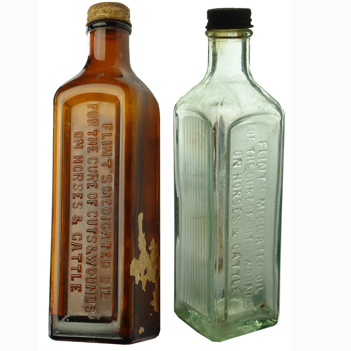 Pair of Flint's Medicated Oil bottles, one amber and one aqua. (South Australia)