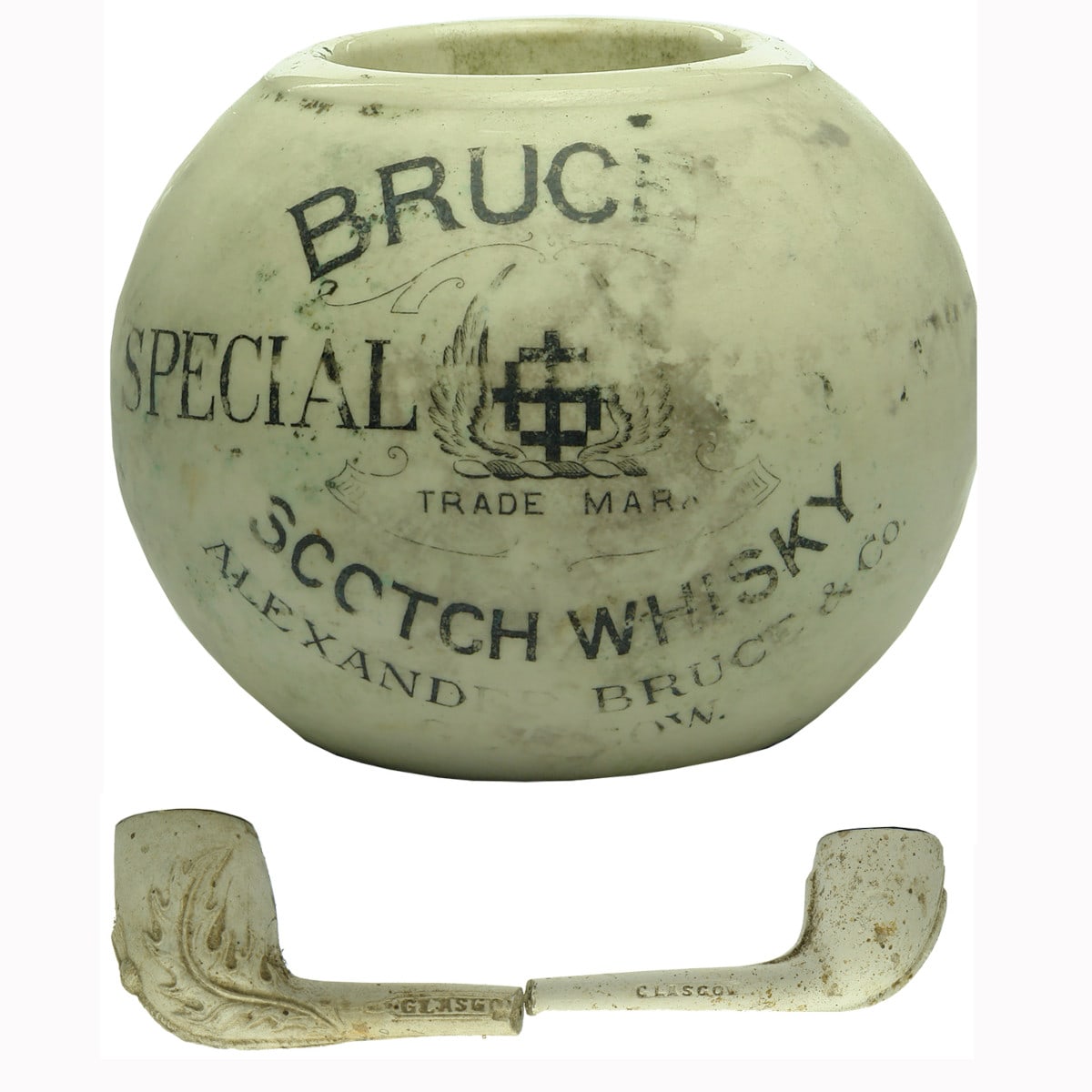 Tobacco related items: Bruce's Scotch Whisky Match Striker and a pair of pipe bowls.