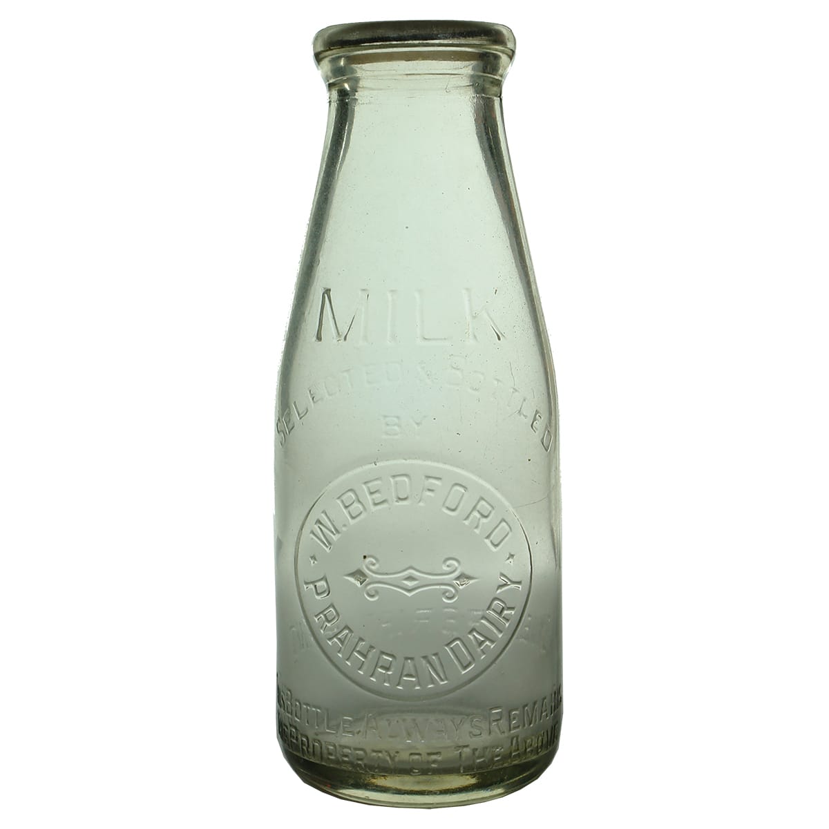 Milk. W. Bedford, Prahran Dairy. Fancy design in middle. Wad top. Clear. Pint. (Victoria)