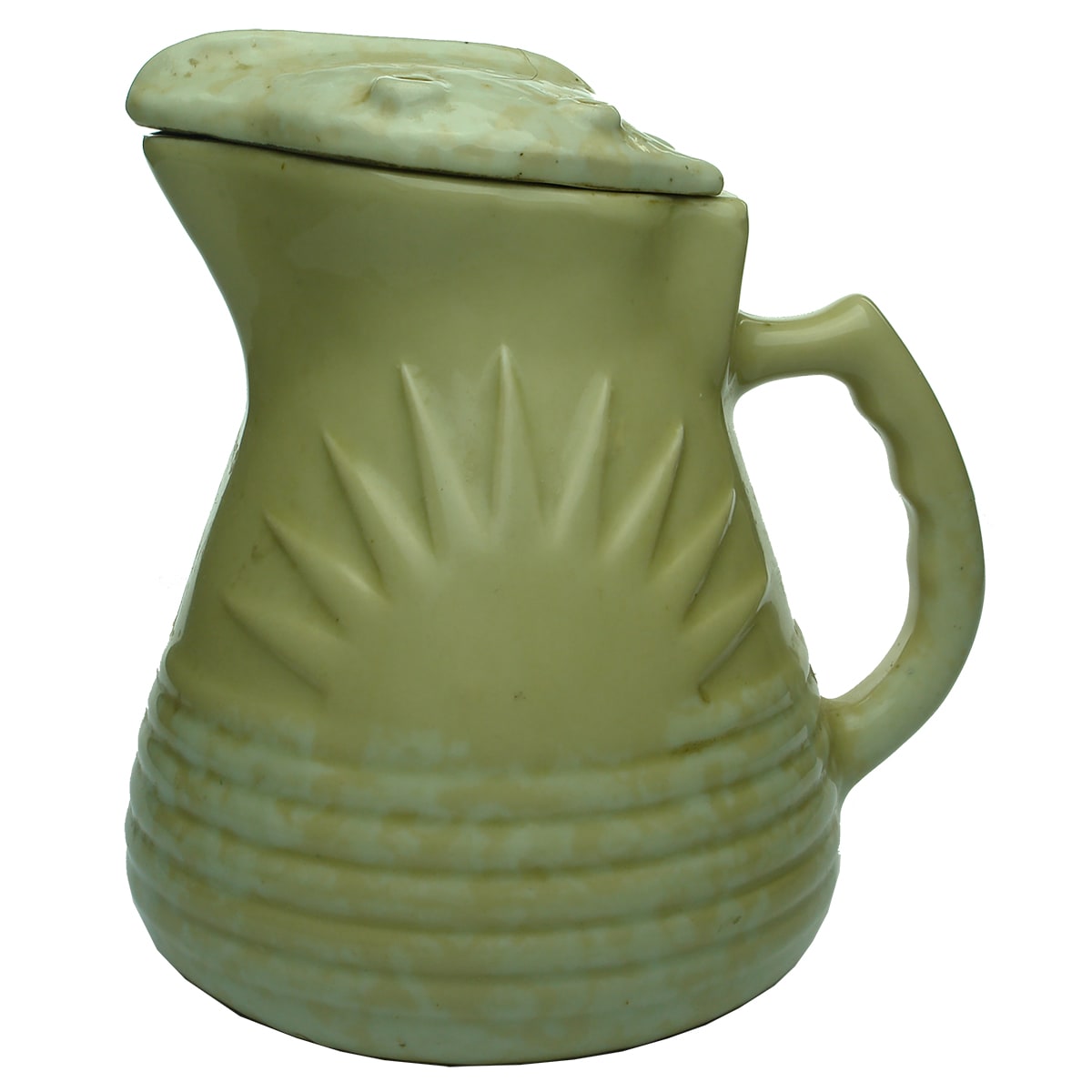 Electric Jug. Sunshine. Rising Sun Pattern. Mottled light yellowish glaze. No markings.