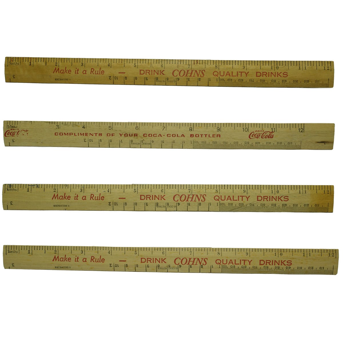 Four advertising rulers from Cohns and Coca-Cola.