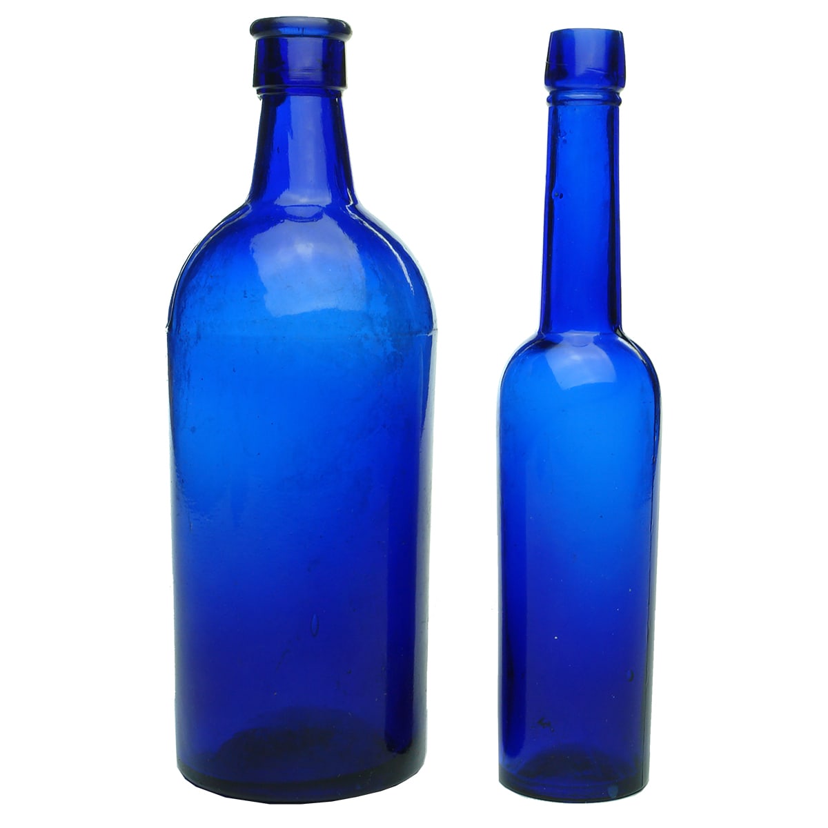 Two blue bottles. Pint pharmacy bottle and a 5 oz castor oil.