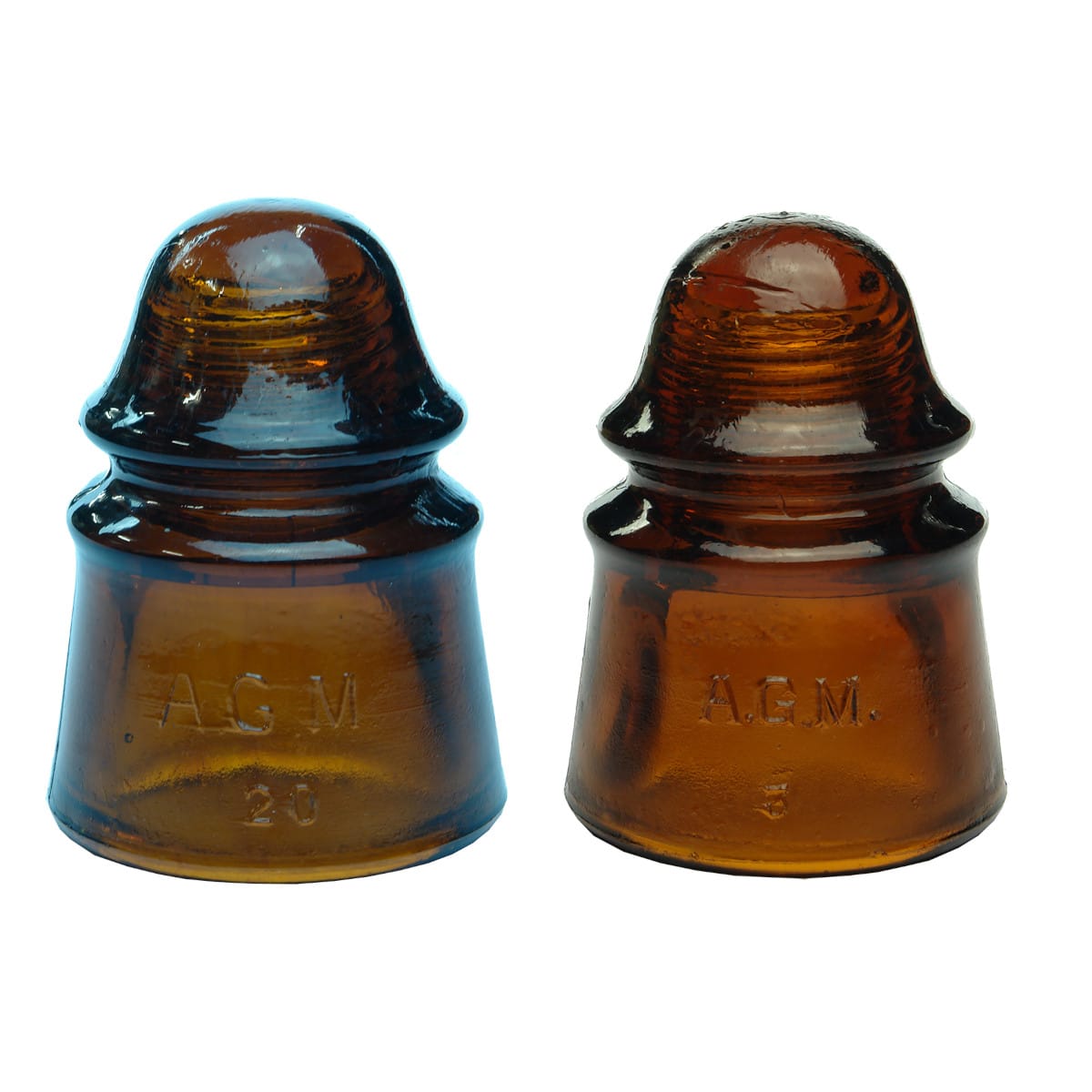 Pair of Amber CD423 Insulators. AGM In large & small print.