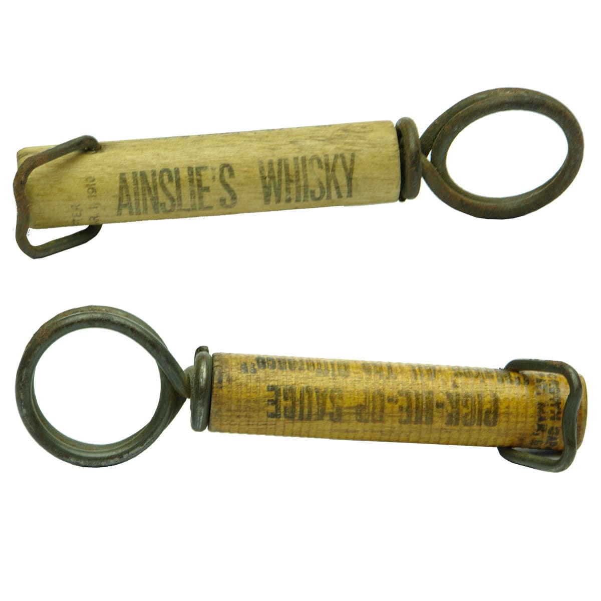 Pair of advertising cork screws. Ainslie's Whisky and Pick-Me-Up-Sauce.