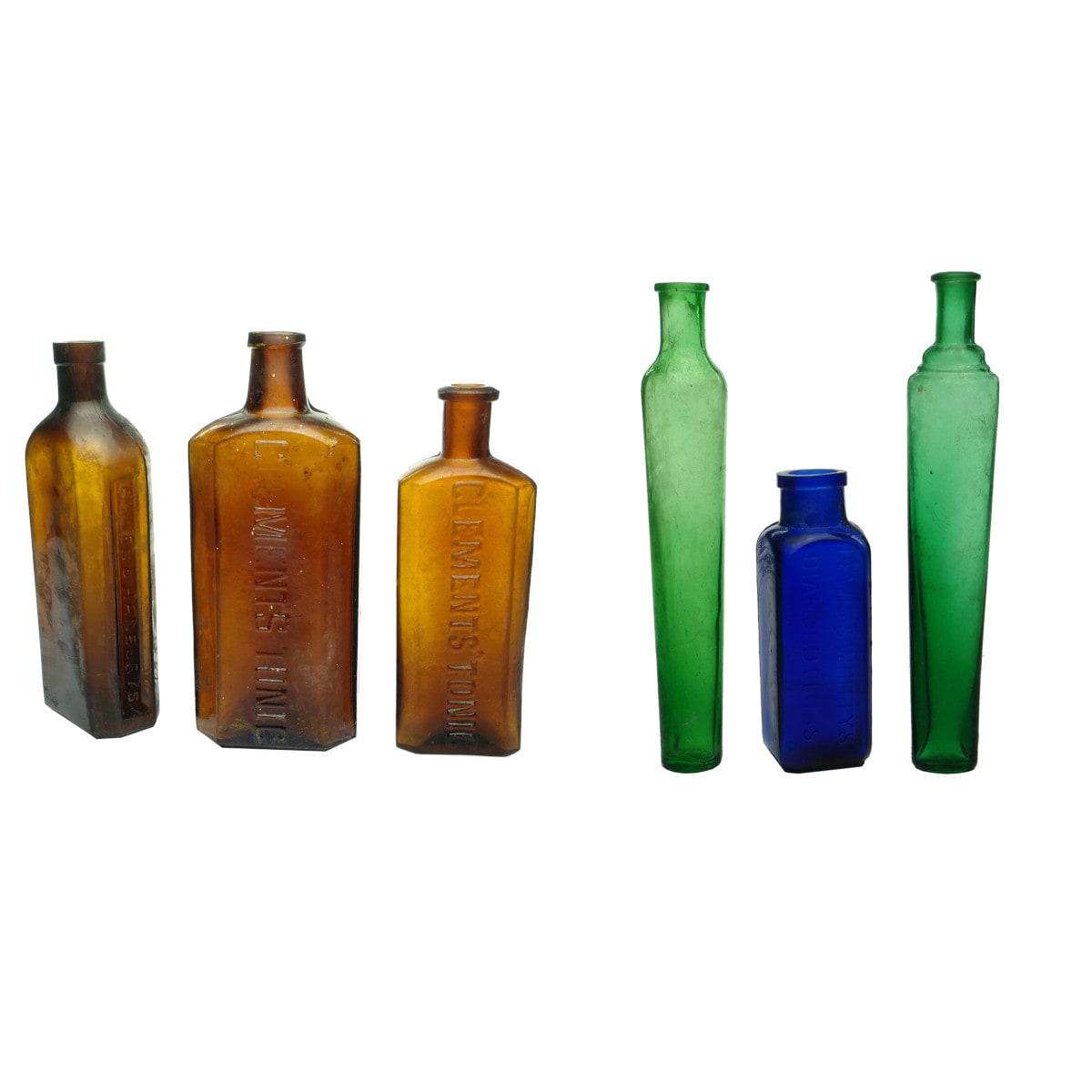 Six Coloured Bottles: Allen & Hanburys; Large Clements Tonic; Small Clements Tonic; 2 x green Eau de Toilettes and a blue Lewis & Whitty Diamond Gloss.