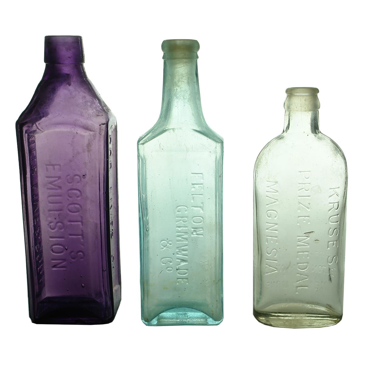 Three Emulsion/Magnesia Bottles: Scott's Emulsion, amethyst; Felton Grimwade & Co, Hypol; Kruse's Magnesia. (Victoria)