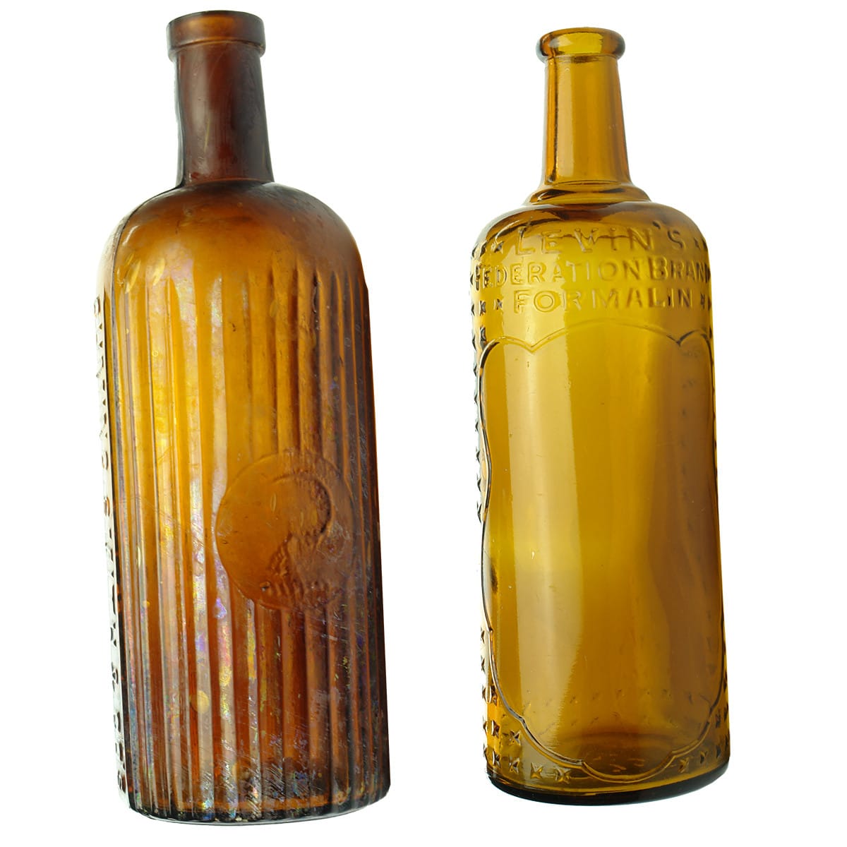 Pair of Poisons. Both Formalin bottles. Cuming Smith & Levin's. Amber. 20 oz.