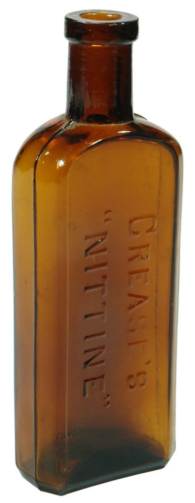 Crease's Nittine Amber Hair Lotion Bottle