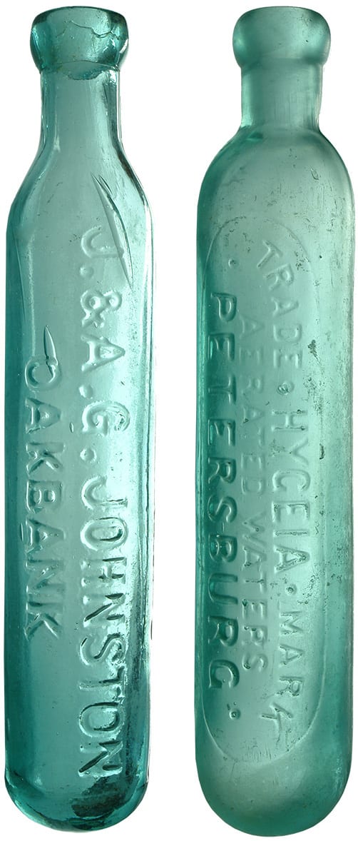 Pair Maughams Carrara Water Antique Bottles