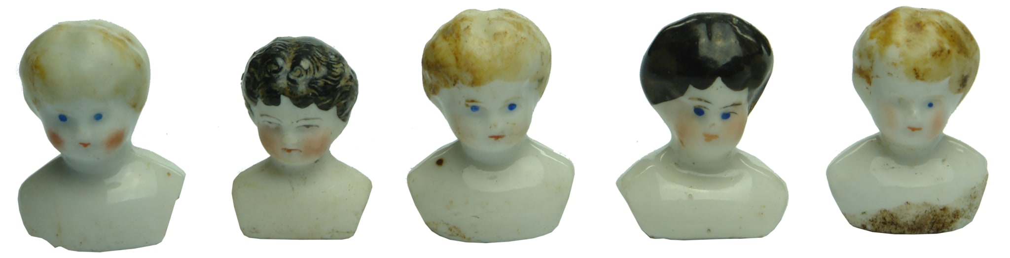 Five small Ceramic Dolls Heads