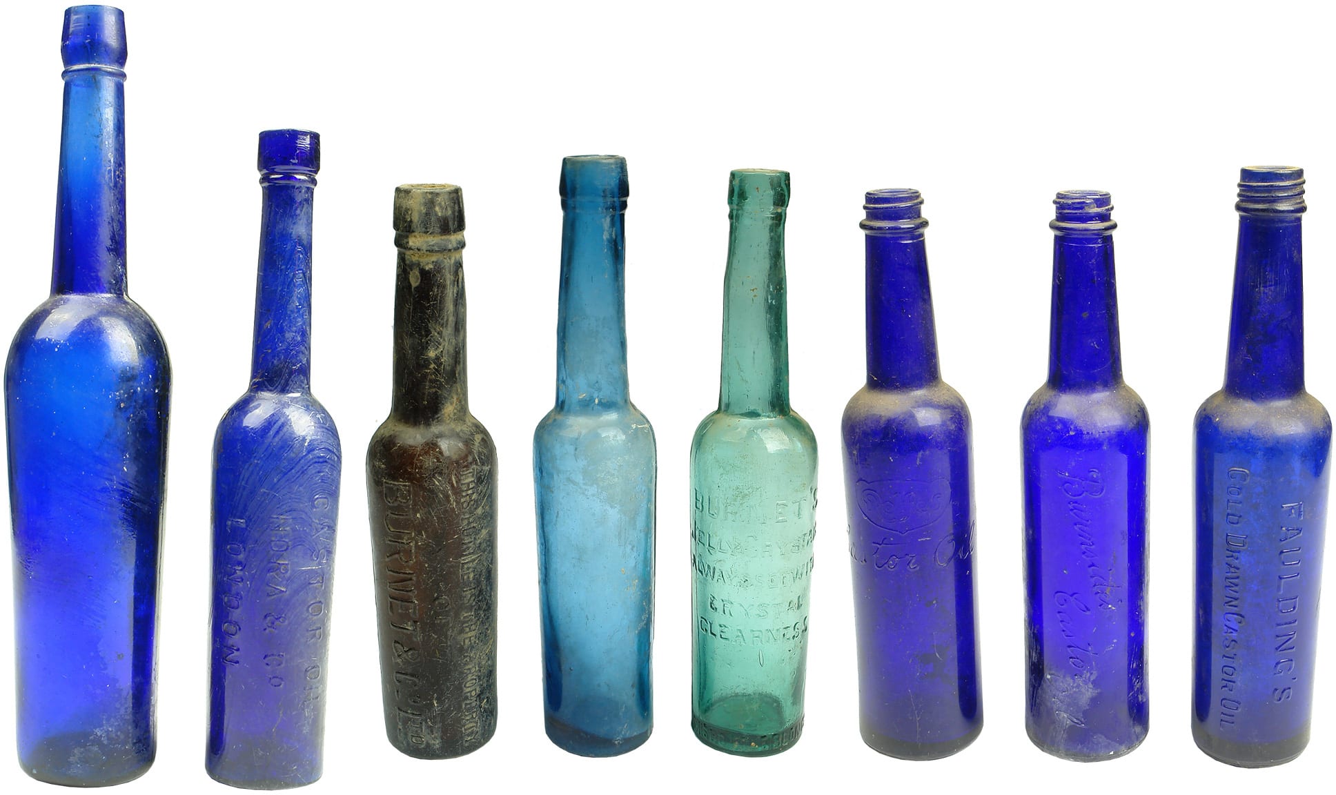 Eight Antique Castor Oil Bottles