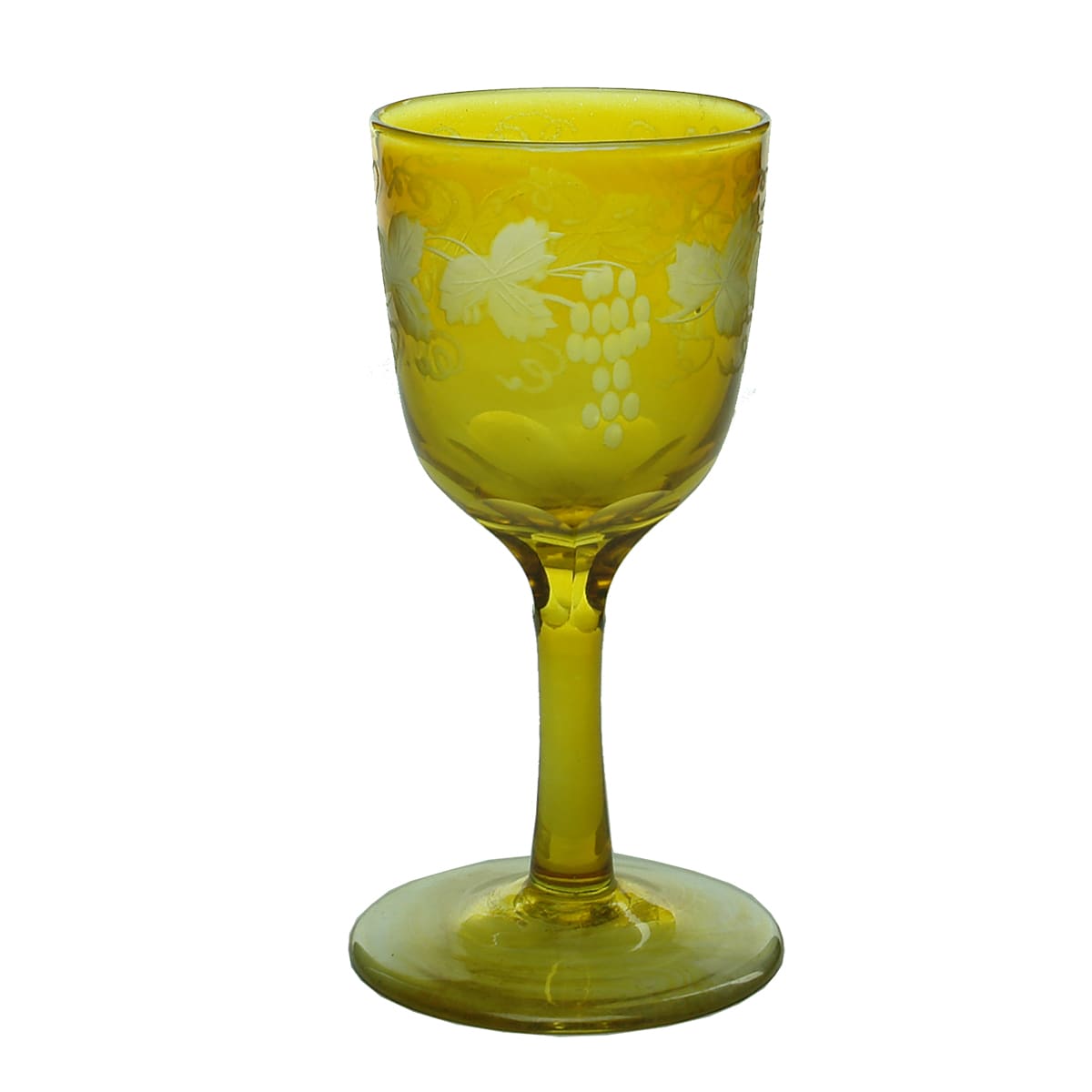 Glass. Early amber stemmed glass with etched grapes and vines and pontil.