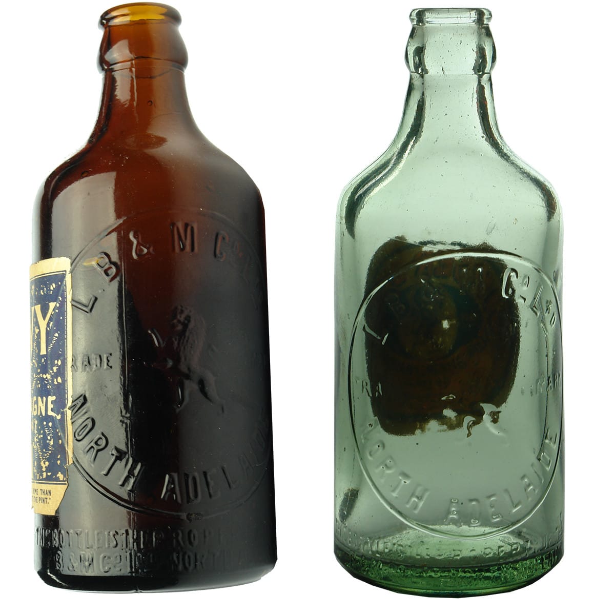 Two L. B. & M. Co. Ltd., North Adelaide glass Ginger Beers. Amber & Aqua. Labelled. (South Australia)