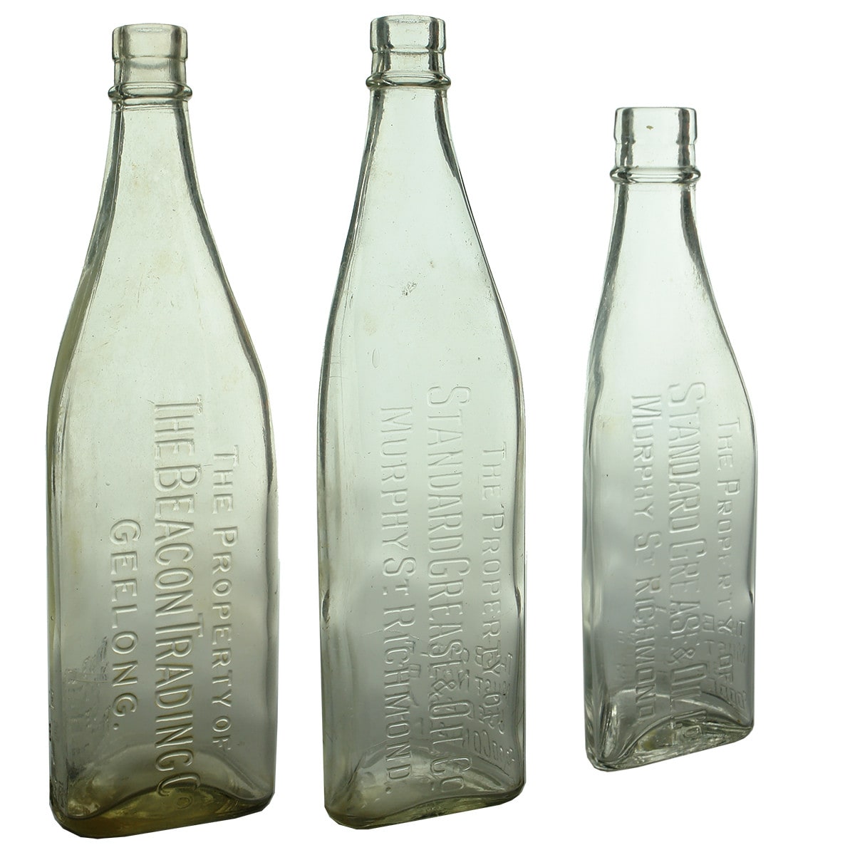 Three Kerosene Bottles: Beacon Trading Co., Geelong & 2 different Standard Grease & Oil Co., Richmond. (VIctoria)