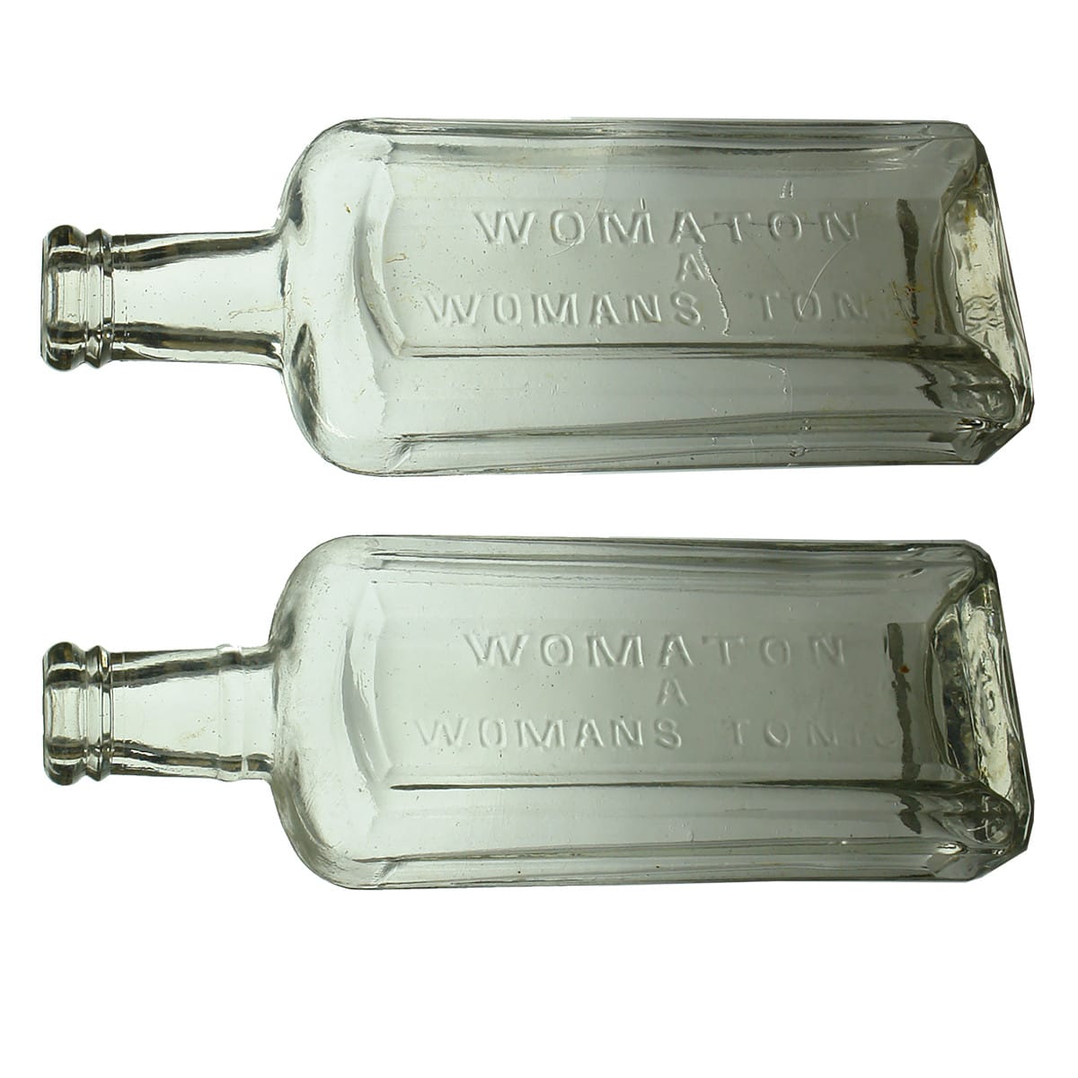 Pair of Cures. Womaton. A Woman's Tonic. Slight variations. Clear. 8 oz. (Victoria)