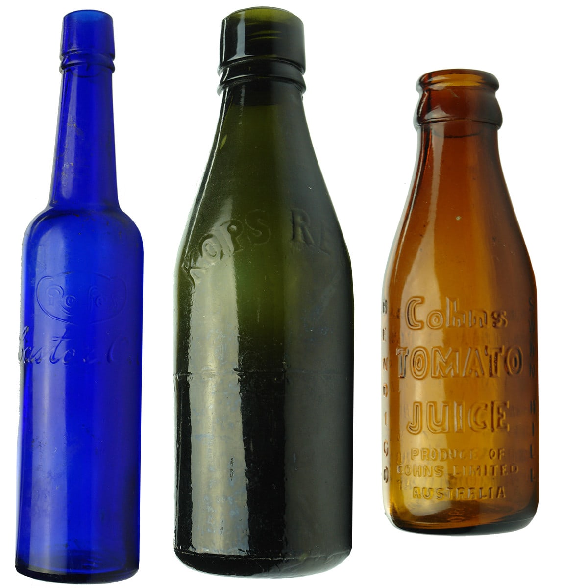 Three coloured bottles: Rolfes Cobalt Castor Oil; Kops small black Internal Thread; Cohns Amber Tomato Juice.