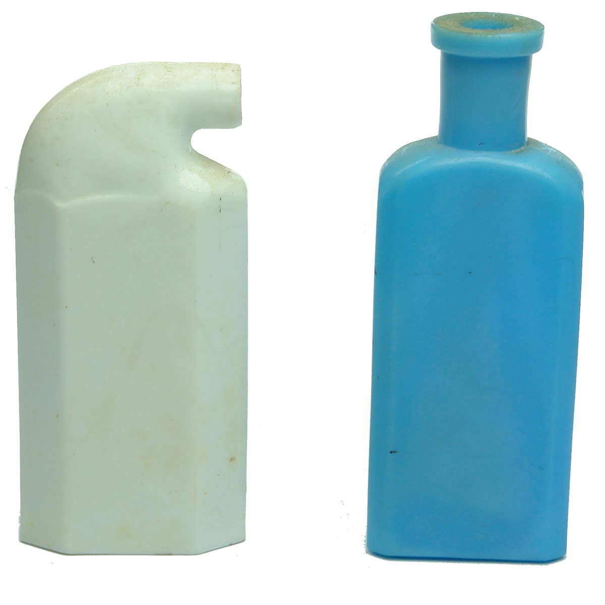 Two milk/opal glass bottles. Blue medicine and White Odol mouth wash.