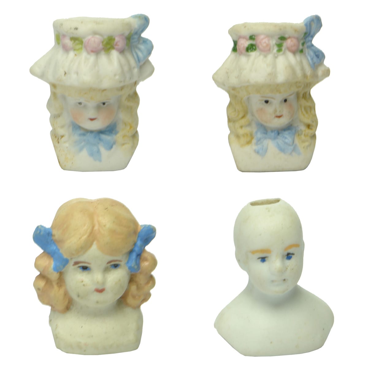 Four Porcelain Dolls Heads