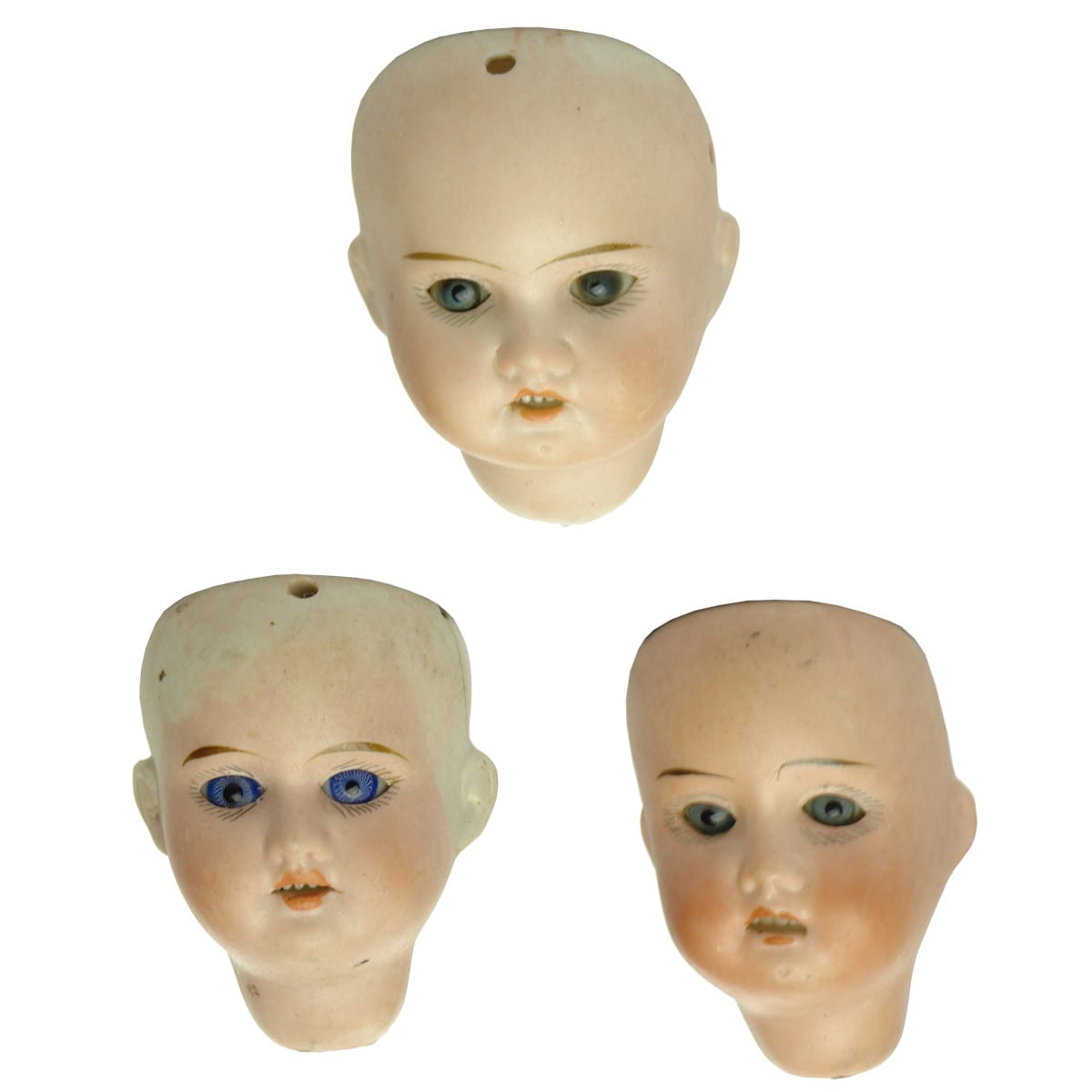 Three German made Bisque Dolls Heads.