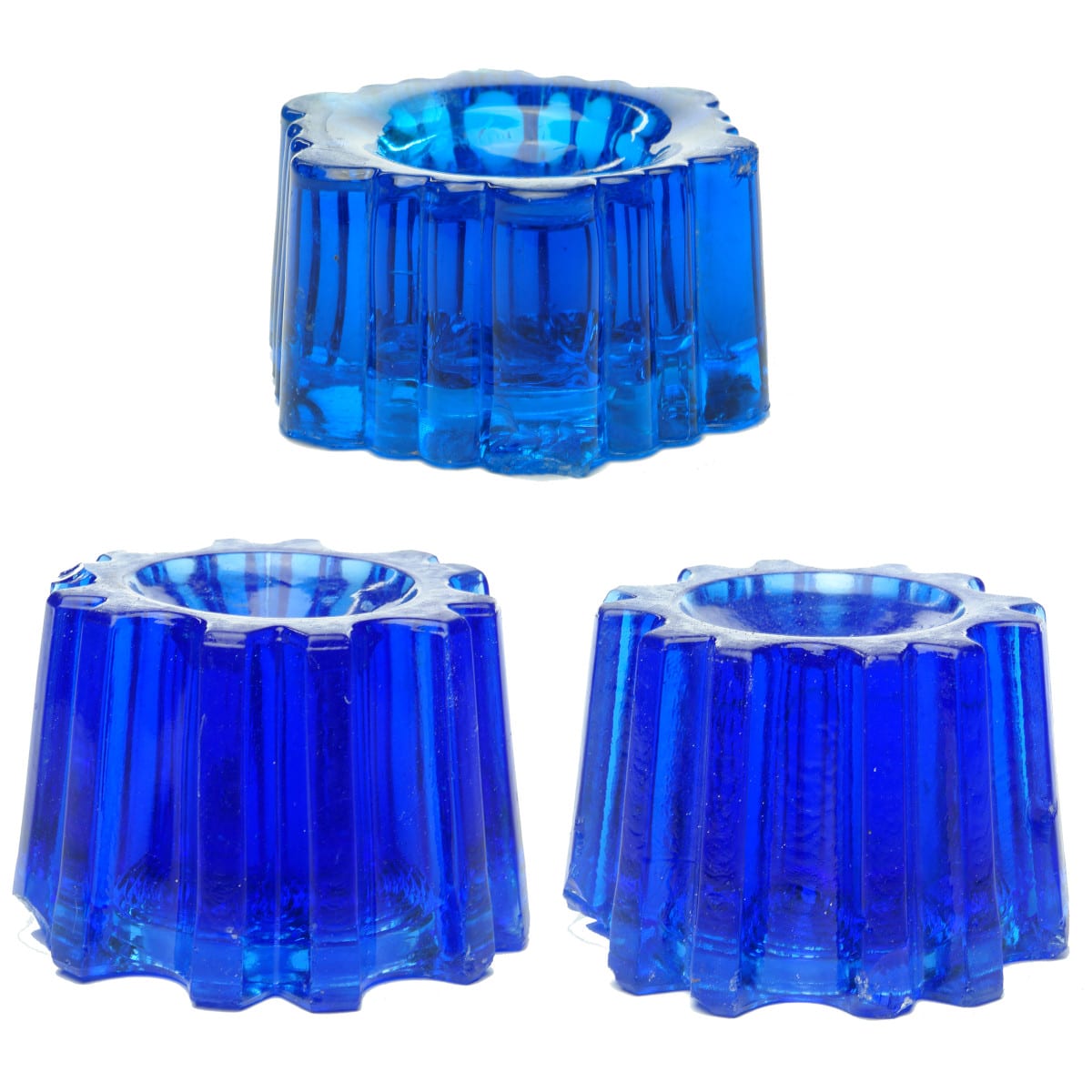 Glassware. Three blue glass piano insulators.