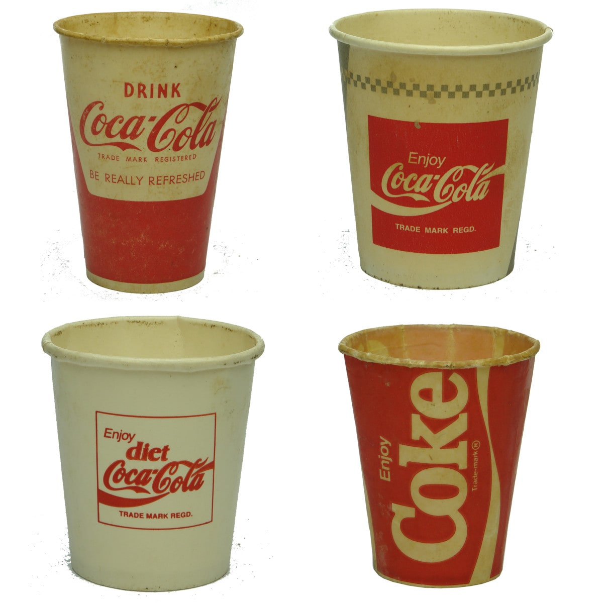 Four different waxed cardboard Coca Cola Cups.