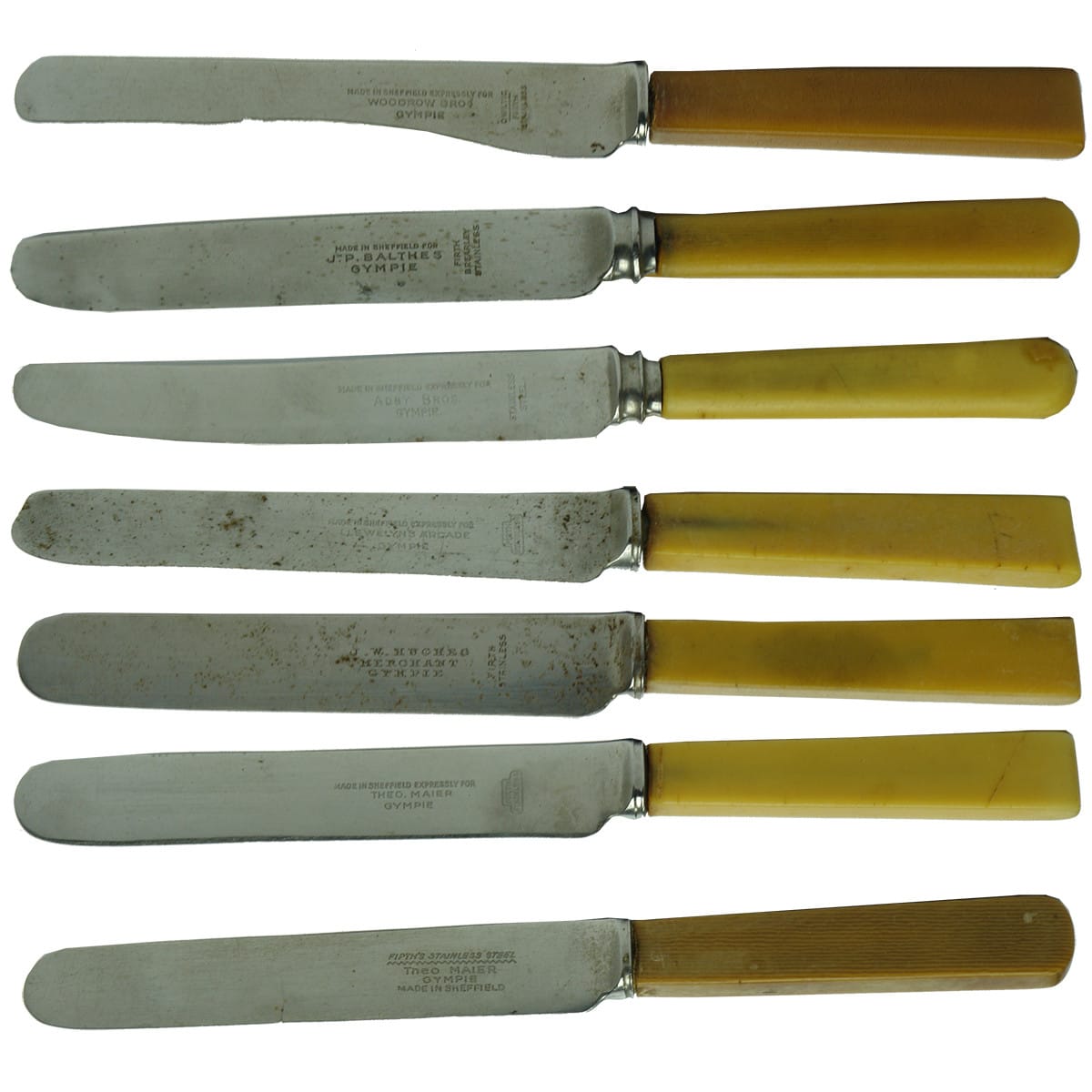 Seven Butter Knives. All stamped for different merchants from Gympie. (Queensland)