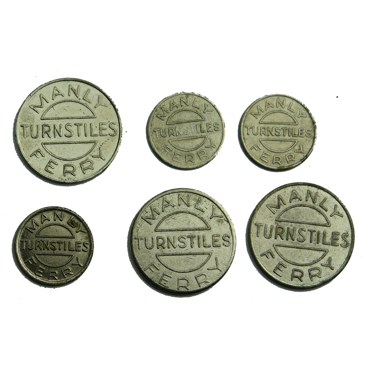 Six Manly Ferry Tokens. 3 large. 3 small.