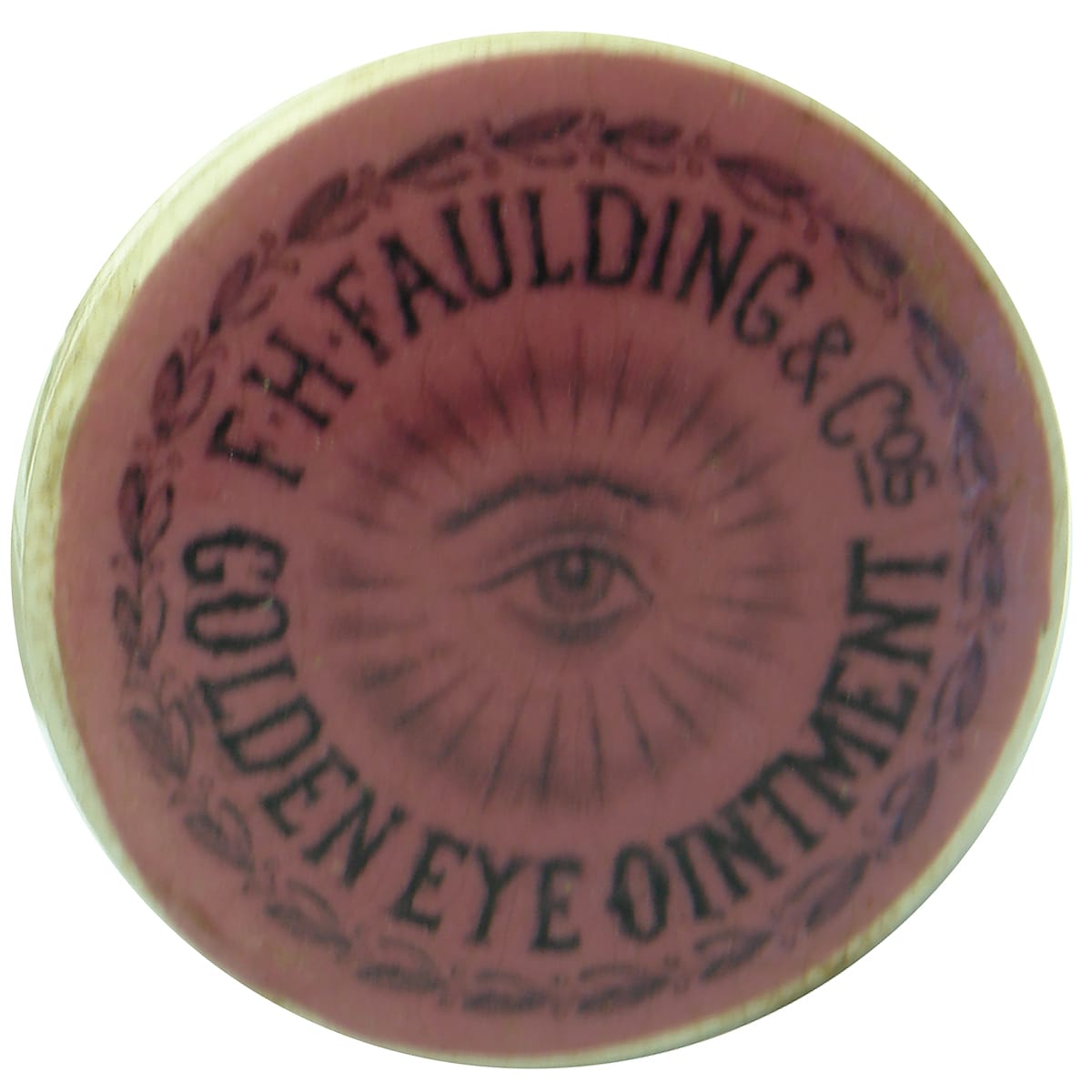 Pot Lid. Faulding, Golden Eye Ointment. Black on Pink. (South Australia)