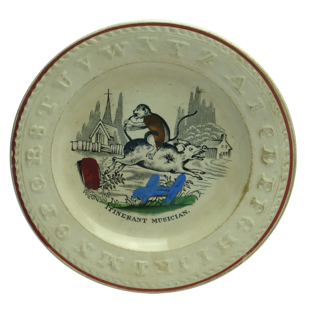 Pottery. Victorian Child's Polychrome Alphabet Plate: Itinerant Musician.