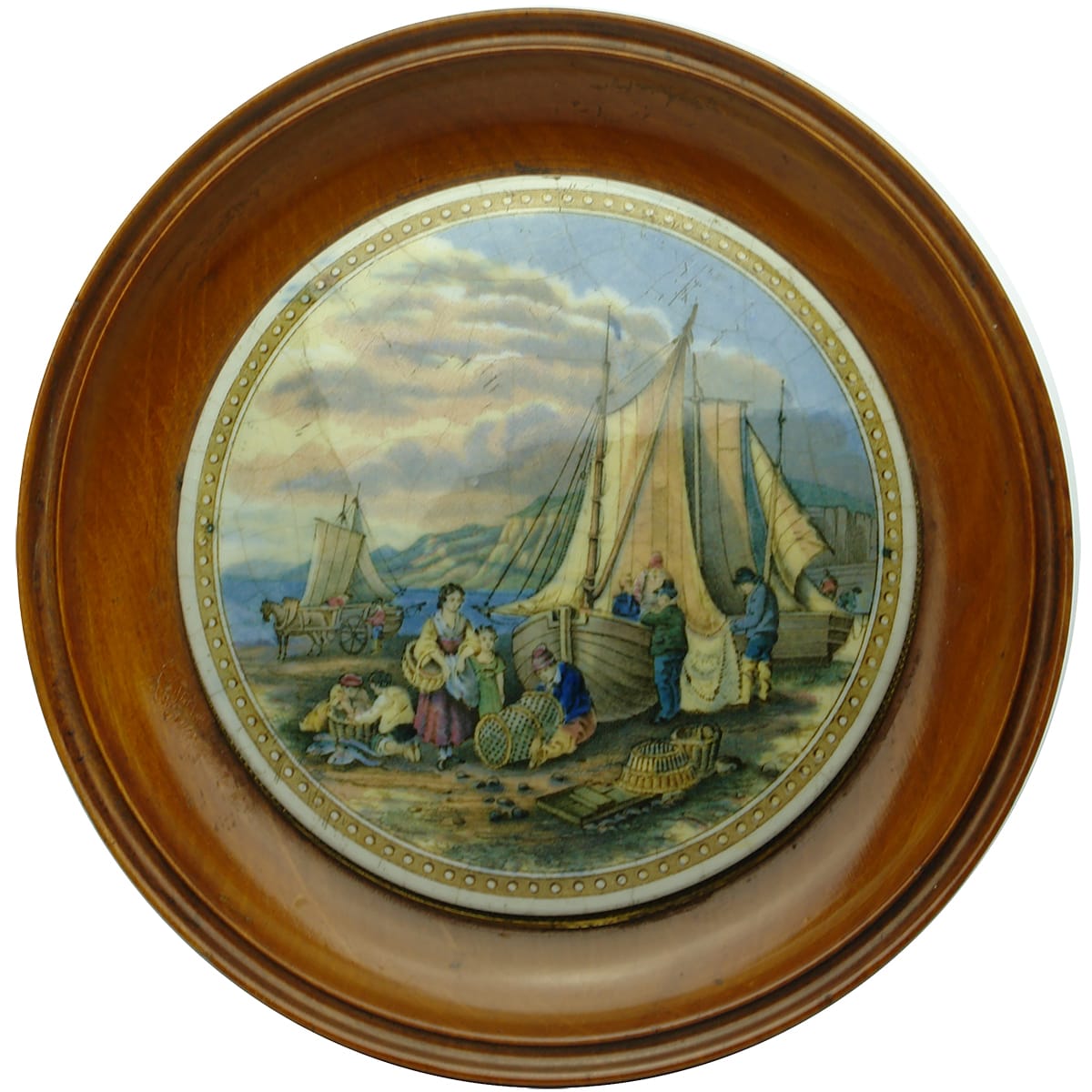 Prattware Lid. Mending the Nets. In a wooden frame.