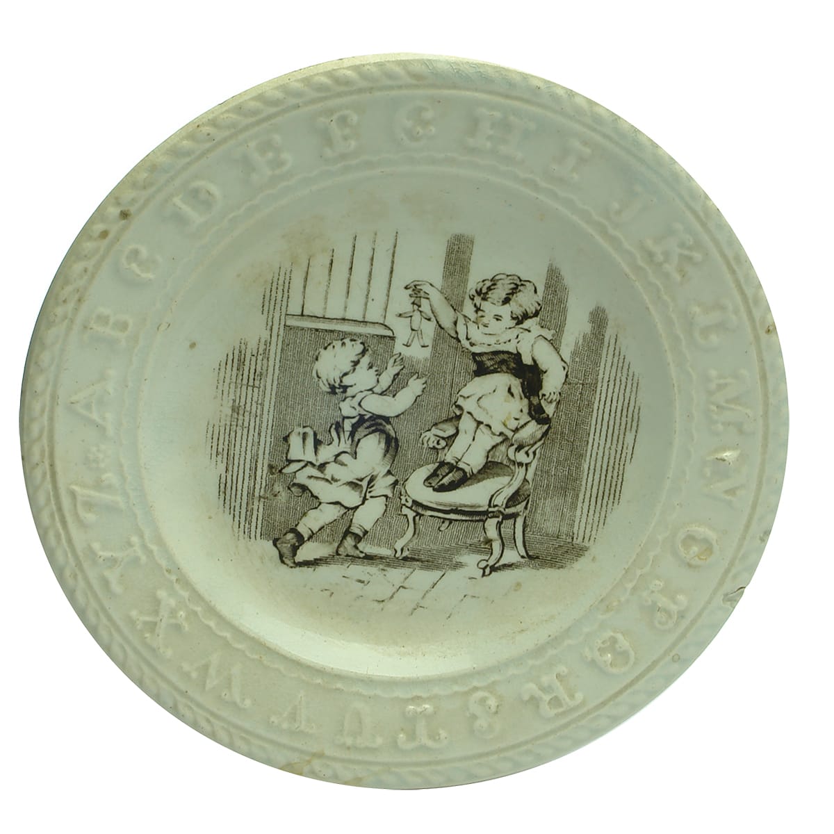 Pottery. Victorian Child's Sepia Monochrome Alphabet Plate Depicting Child On Chair Teasing Another Child With A Toy.