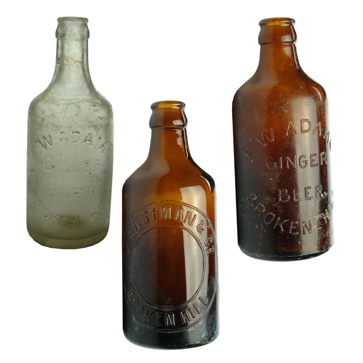 Three Broken Hill Crown Seal Dump Ginger Beers: 2 x Adams(Amber & Clear); Eastman. (New South Wales)